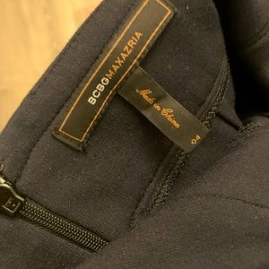 BCBG BLACK SKIRT WITH SIDES POCKETS. Elegant & modern can be dressed up or down